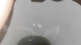 Shaved pussy wife spread legs and pissing in closeup