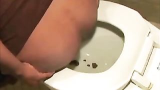 Ebony milf with curvy ass pooping in toilet