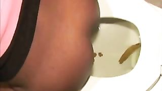 Ebony milf with curvy ass pooping in toilet