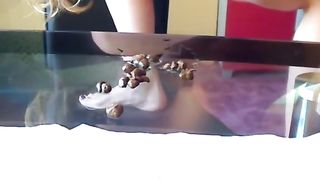 Lovely blonde mom pooping on the glass table