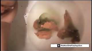 Amateur girl with sexy body pooping in toilet