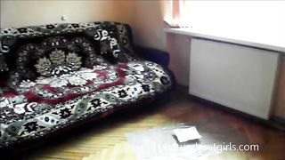 Naughty lady pooping in a plastic container