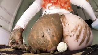 Redhead bitch rides huge candy dildo while poop smearing it