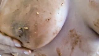 Smearing shit on her tasty big boobs