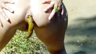 Naught babe with smooth ass pooping in the forest