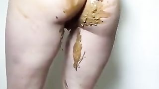 Beautiful naked busty teen poops in her white panties