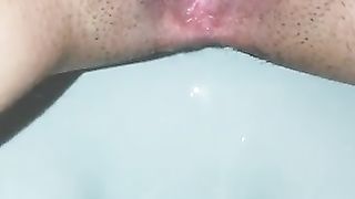 Closeup of sexy lady pissing and pooping