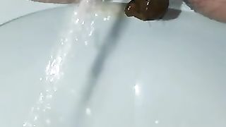 Closeup of sexy lady pissing and pooping