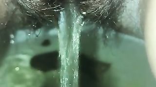 Hairy lady piss and poop closeup