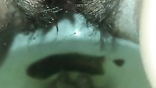 Hairy lady piss and poop closeup