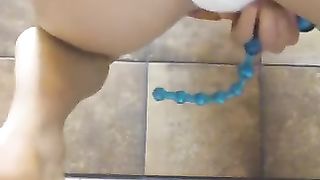 Amateur lady using anal beads while pooping in her panty