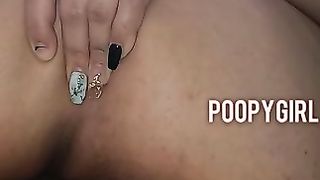 Poopy girl masturbates in solo