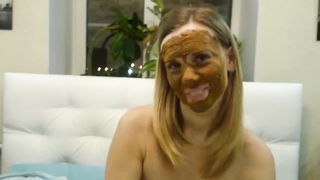 Blonde babe smears poop on her pretty face