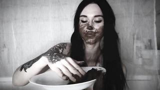Gothic slut eating her own waste