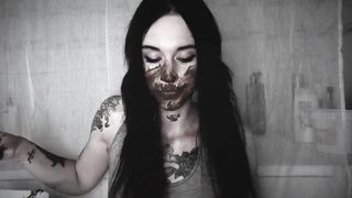 Gothic slut eating her own waste