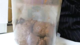 Brunette beauty takes a steaming shit in a plate