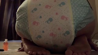 Girl poops in her diaper at home