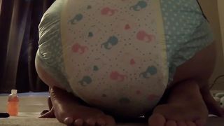 Girl poops in her diaper at home