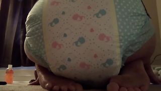 Girl poops in her diaper at home