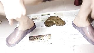 Korean woman poops on the newspaper