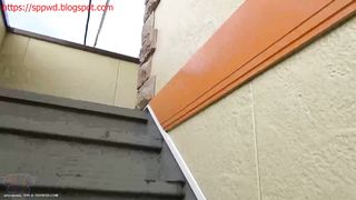 Lady pooping in front of her house