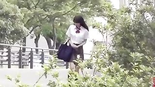 Japanese schoolgirl pooping in tall grass