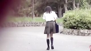Japanese schoolgirl pooping in tall grass