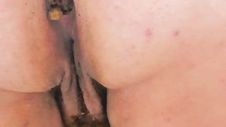 Closeup pooping in hotel toilet