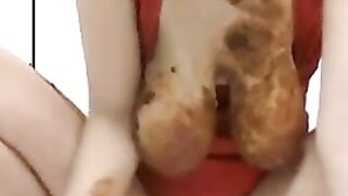 Girl squats and takes a huge shit into a cup