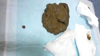 Kinky babe poops on the sofa