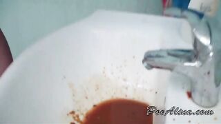 Girl in bikini splashing on the sink