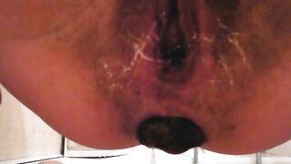 Wet hairy pussy lady dropping meaty turd