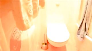 Cute lovely lady pooping in the toilet