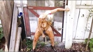 Blonde breasted MILF shitting in the shabby courtyard