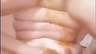 Brunette shit on her face and fisting herself in solo