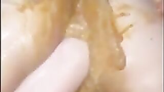 Brunette shit on her face and fisting herself in solo