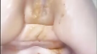 Brunette shit on her face and fisting herself in solo