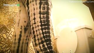 Beautiful lady pooping in toilet