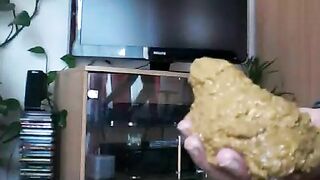 Lady poops heavily in hand