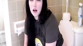 Cute brunette young babe pooping in the toilet