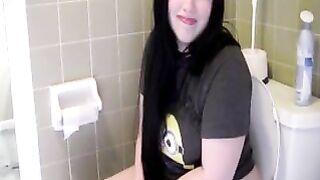 Cute brunette young babe pooping in the toilet