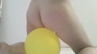 Shitting on a big yellow balloon