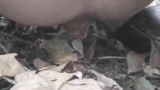 Pretty brunette girl pooping in the park