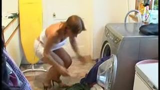Girl peeing in the washing Machine