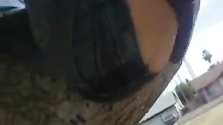 Girl pisses on her pants from above the tree