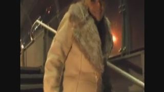 Hot blonde girl lets out a long stream of piss in a public plac