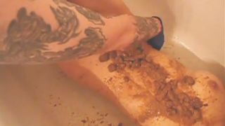 Girl bathes and eats mud-like shit