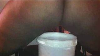 Ebony slut Caroline taking piss and poop in a bucket