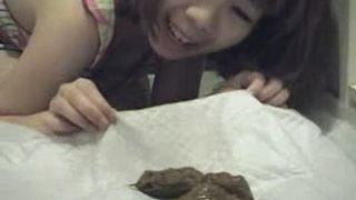 Asian Girl plays with her shit
