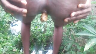 African lady pooping outdoor